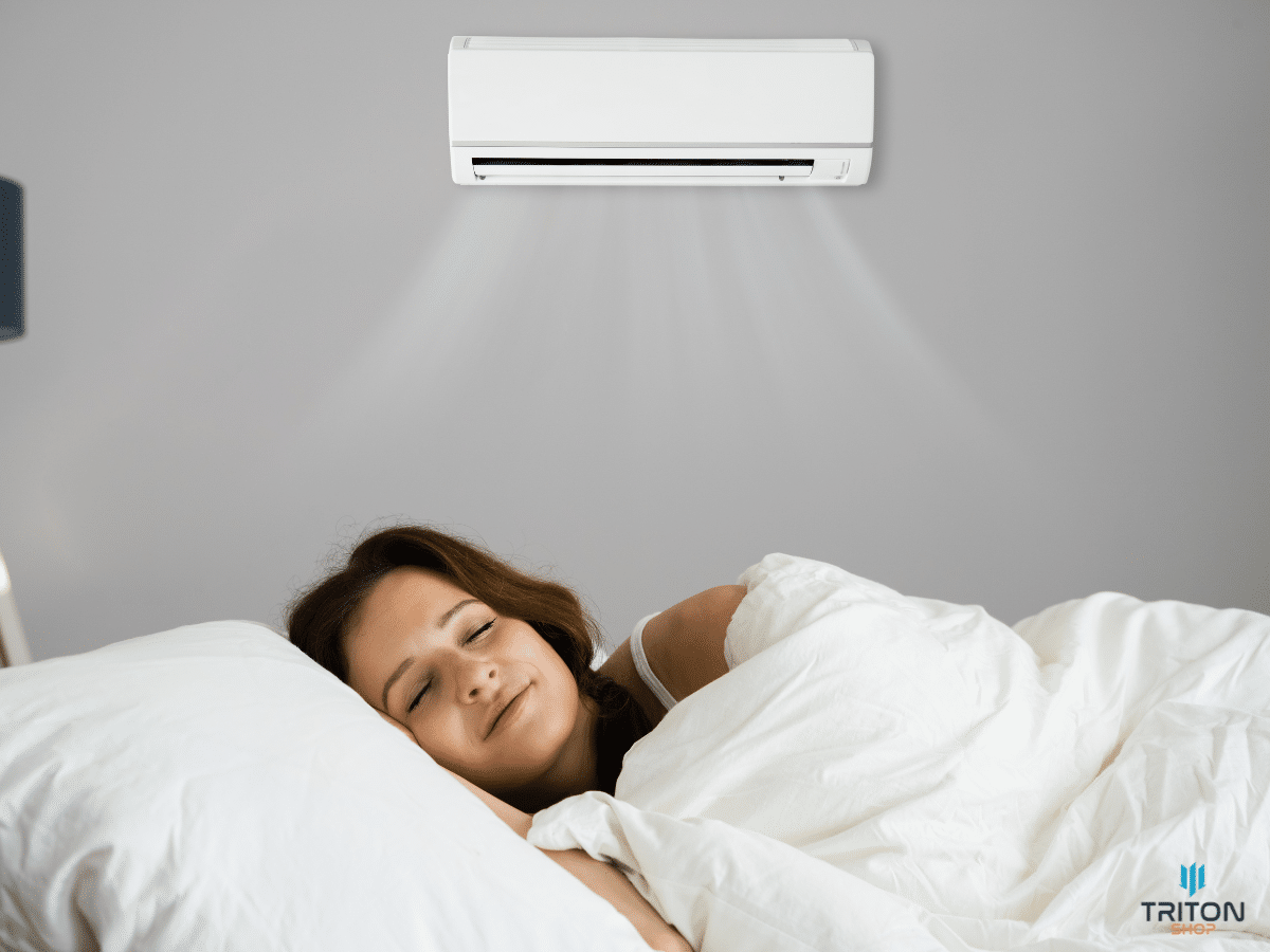 Az inverteres légkondicionálók működése és előnyei - nő alszik a klíma alatt 