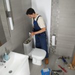 male-plumber-working-fix-problems-client-s-house-768x512