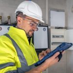 man-electrical-technician-working-switchboard-with-fuses-uses-tablet_169016-24154-768x512